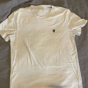 Suspicious T - skull logo